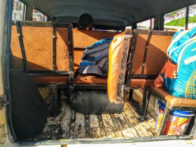 The back seat of a Mahindra Maxx has been altered to act as a small gate