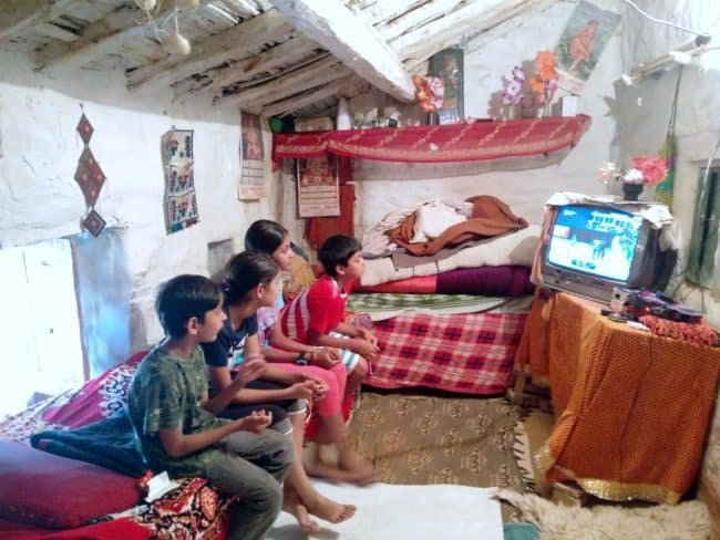 kids watching Cricket match in traditional Kumaoni house
