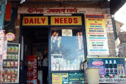 Daily Needs shop in Kasauli, Himachal Pradesh, India.If you are a Ham lover like my husband then don't miss peppery ham, hamburgers and perfectly toasted caraway-strewn bun at Daily Needs. Jai Kishan Thakur and his son Akhilesh are the third and fourth generation to run this popular shop. Click to read more