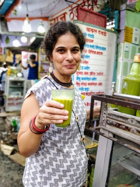 First-time bhang user drinking mild strength bhang thandai at Badal Thandai in Varanasi