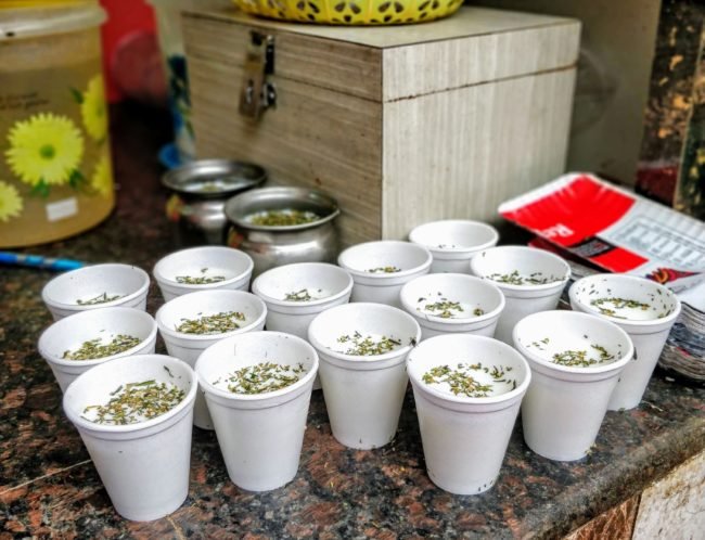 Raw milk and bhang leaves prepared as offering for Lord Shiva worship in Varanasi