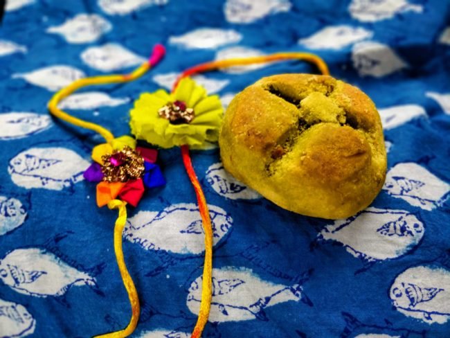 Fresh bhang thandai being prepared with milk, spices, and cannabis leaves in Varanasi shop