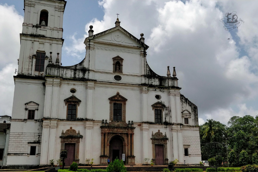 Front view of Se Cathedral Goa showing the detailed Portuguese-Gothic architectural elements including the ornate towers, baroque decorative features, and the Golden Bell tower