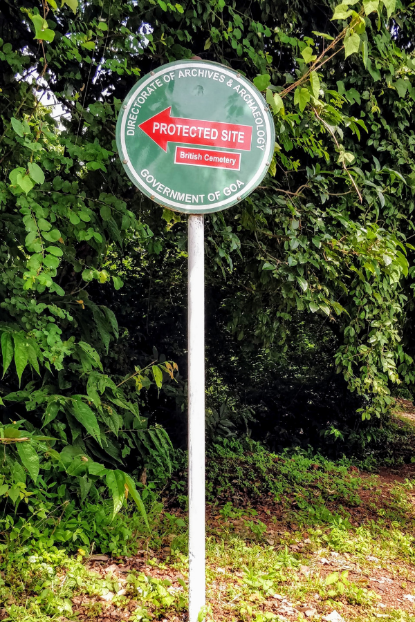 Roadside signpost indicating the location of the British Military Cemetery near Raj Bhavan in Goa