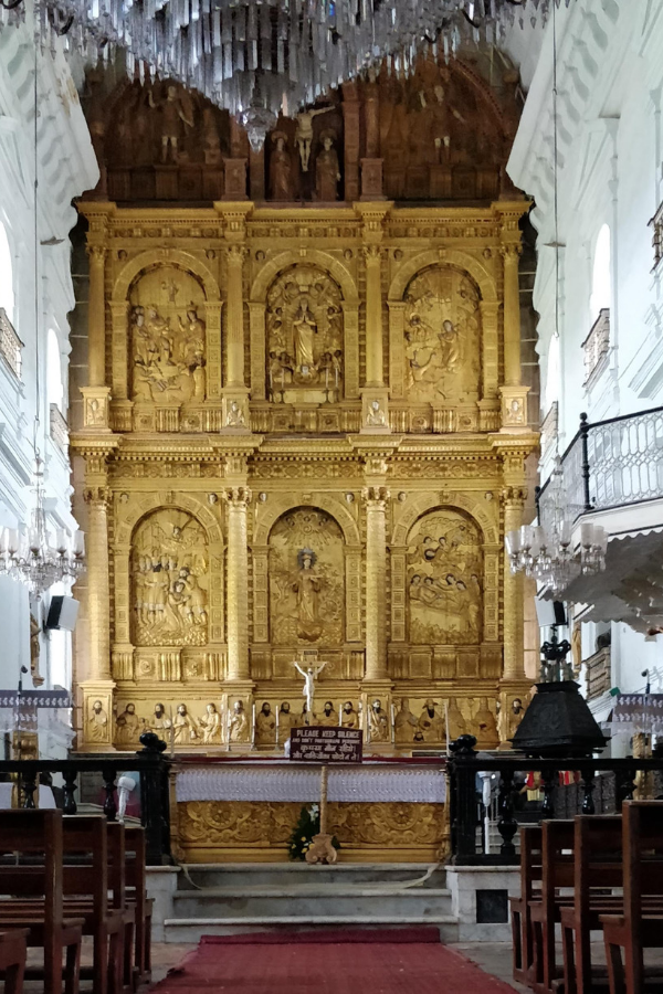 Side view of Se Cathedral showcasing the baroque and Portuguese-Gothic architectural blend with detailed stonework and religious statuary