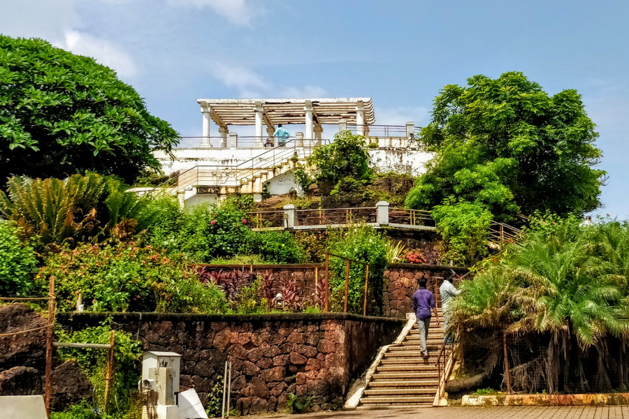 The Belvedere structure at Dona Paula - a Greco-Roman style observation point with white pillars offering panoramic views of the Arabian Sea and Zuari river confluence